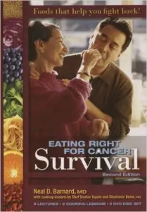 Couple sharing healthy food, cancer survival book.