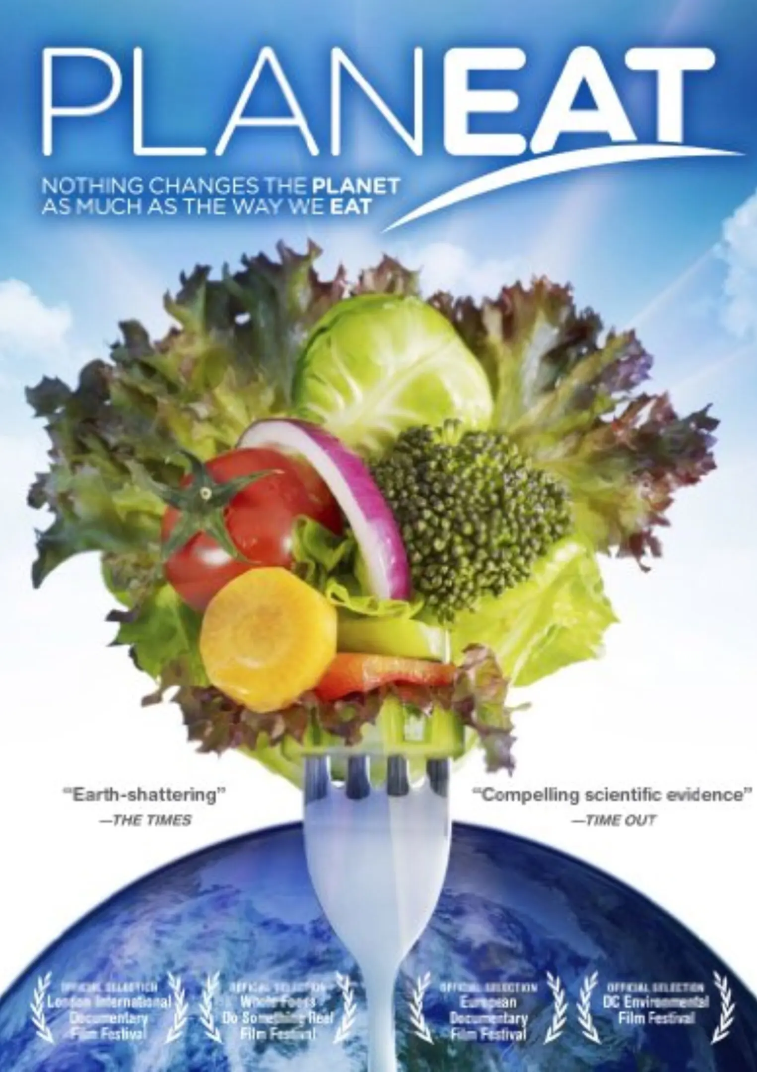 Fork with vegetables on Earth background.