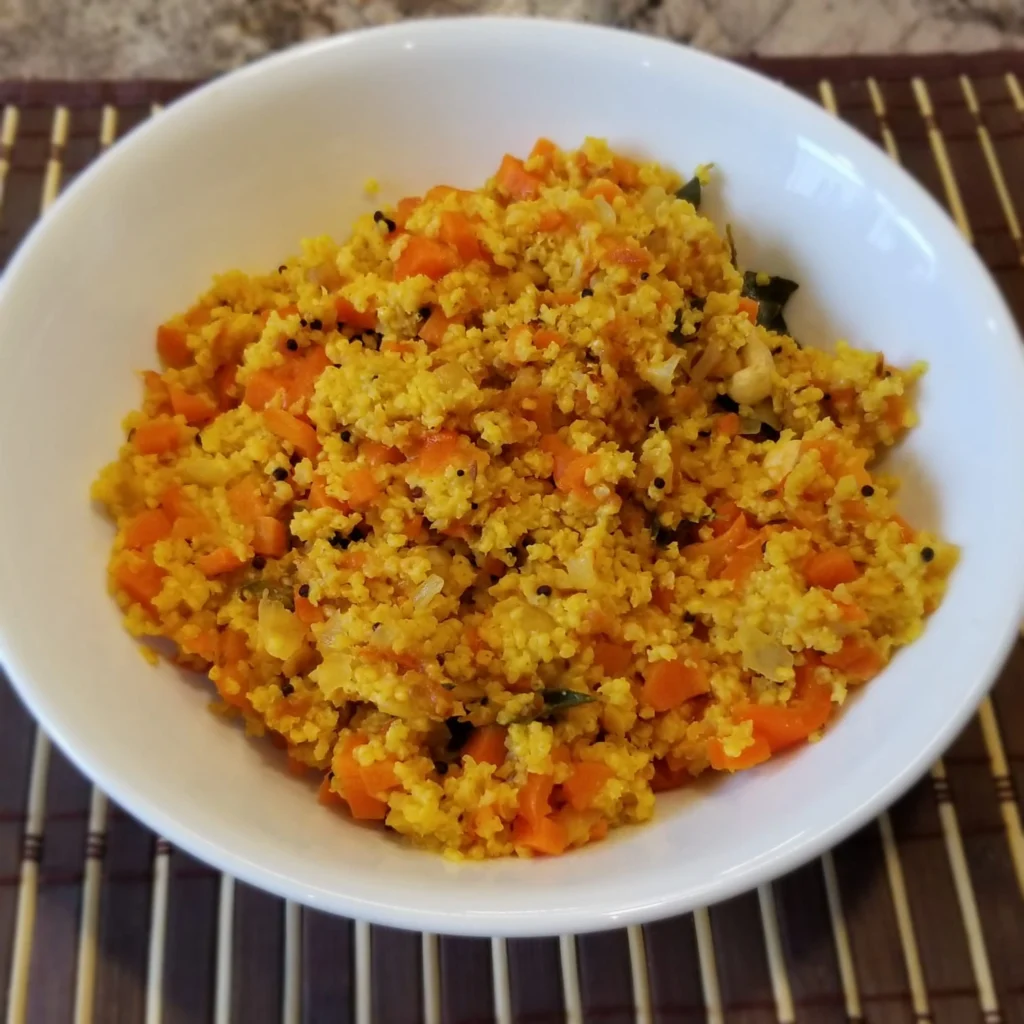 Bowl of seasoned couscous with vegetables.