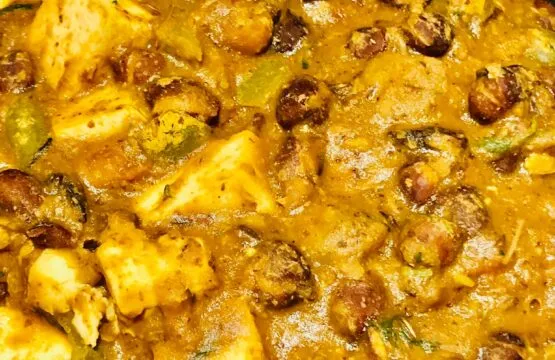 Spicy curry with paneer and vegetables.