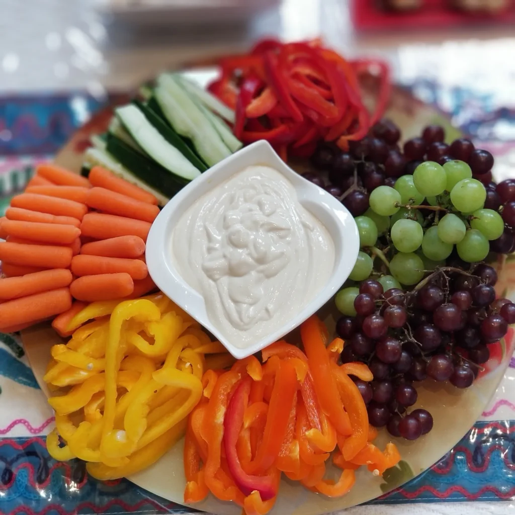 Vegetable and fruit platter with dip.