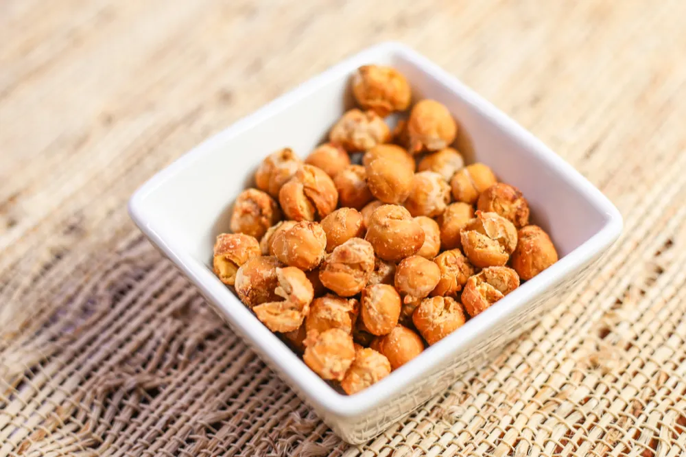Roasted chickpeas in a white bowl.