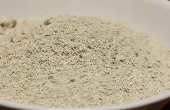 White bowl filled with fine brown powder.
