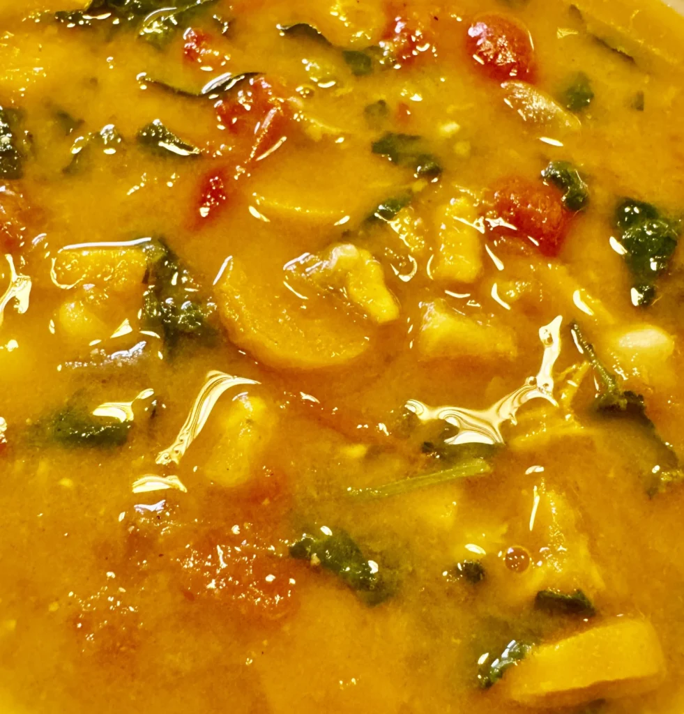 Hearty vegetable soup with colorful ingredients.