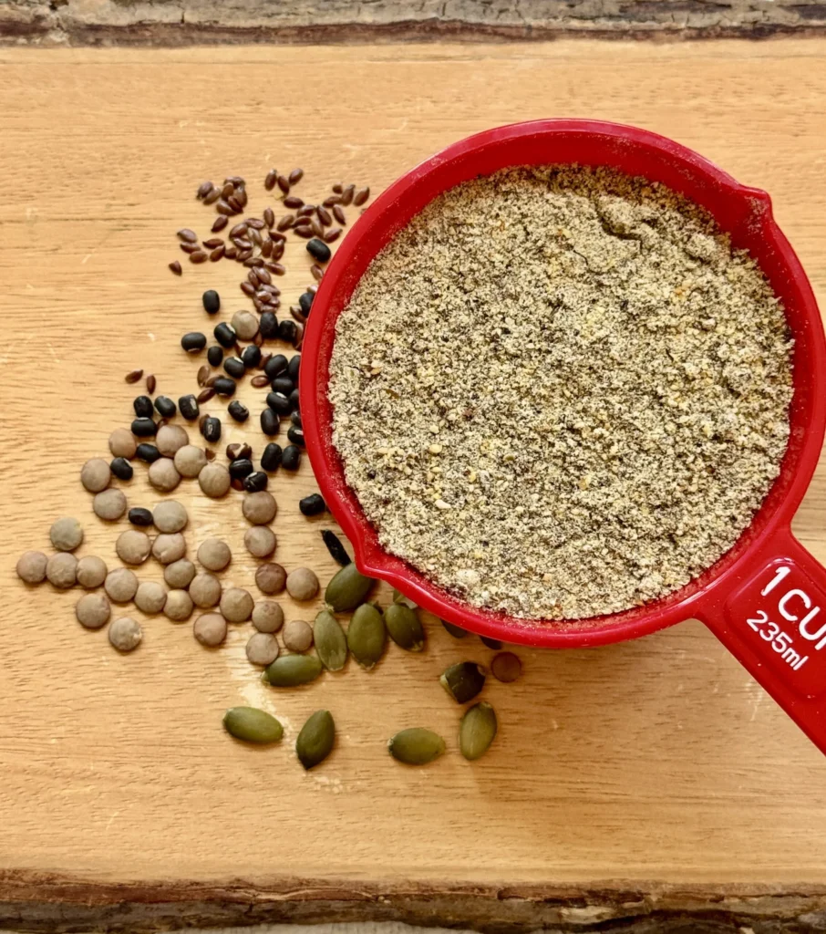 Measuring cup with seeds and ground flaxseed.