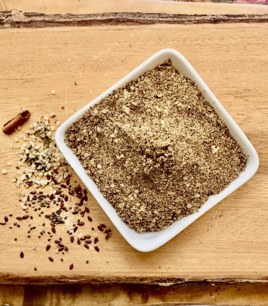 Spice mix in square bowl on wood.