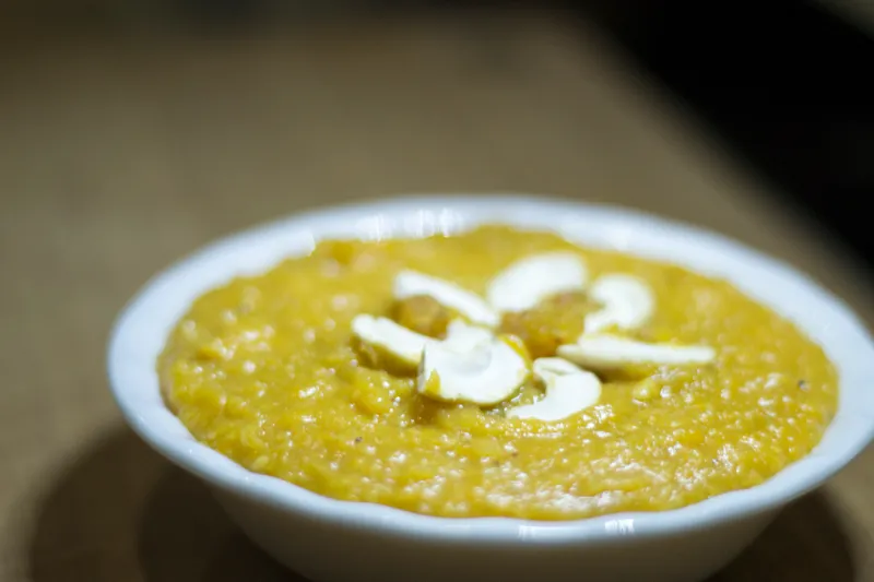 Bowl of sweet dish with nuts.
