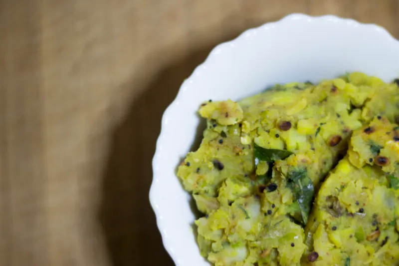 Yellow mashed dish in a white bowl.