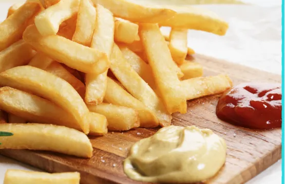 Fries with ketchup and mustard on board.
