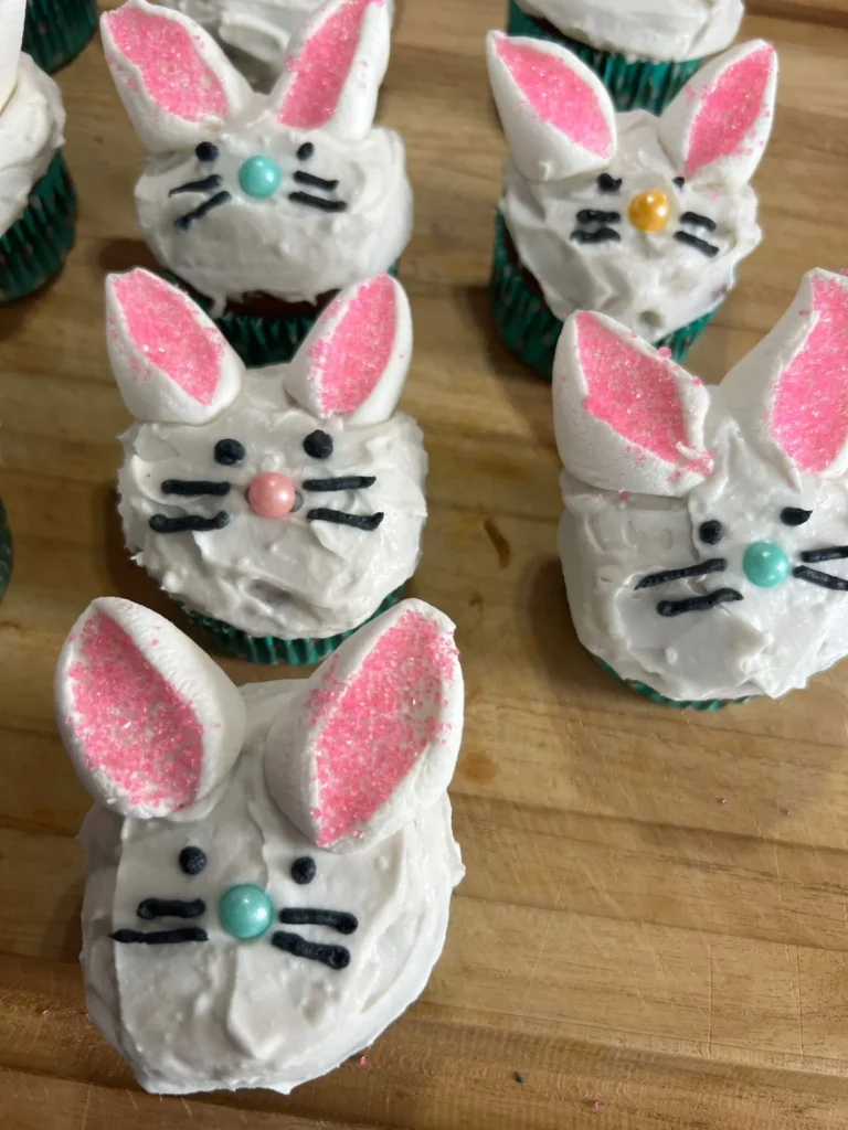 Bunny-themed cupcakes with pink ears.