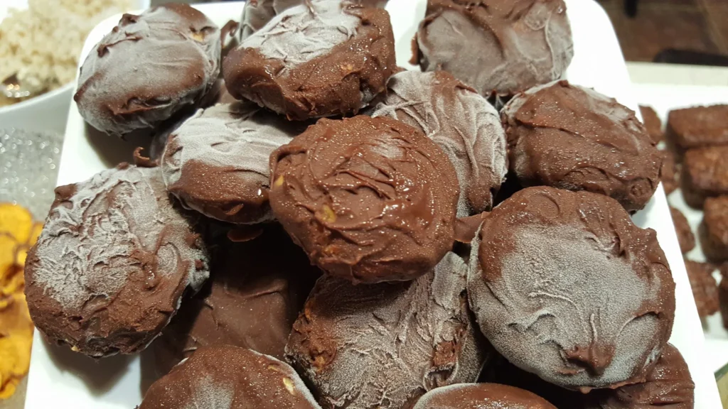 Chocolate-covered treats stacked on a plate.
