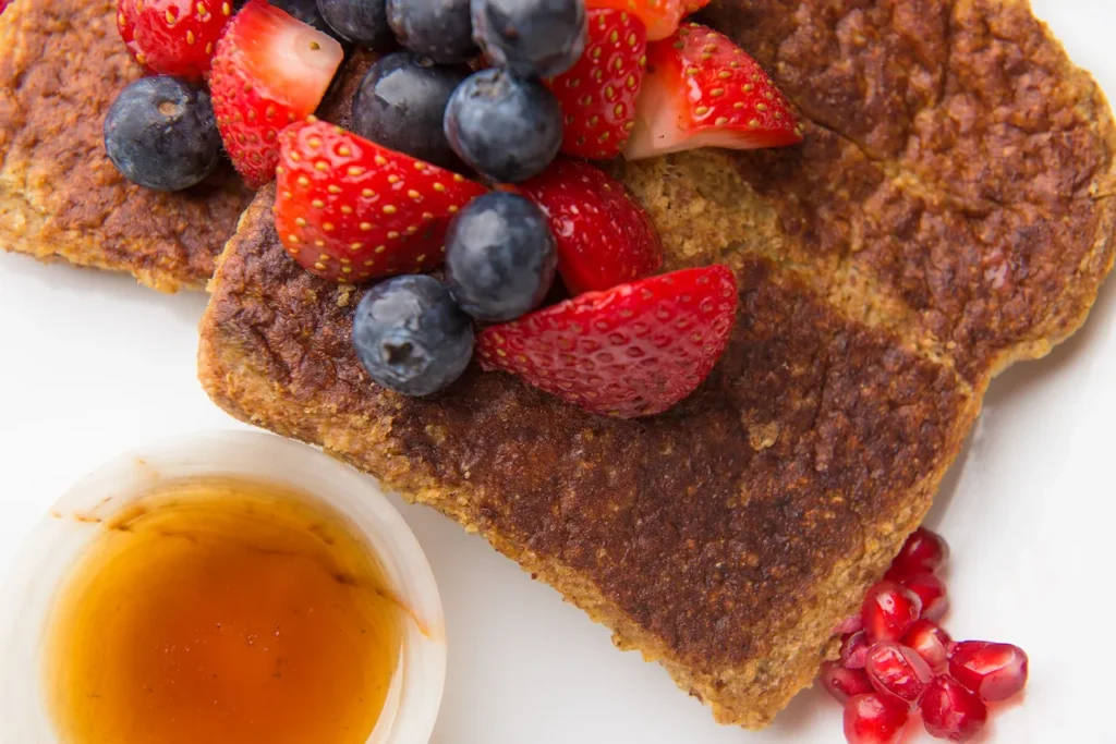 French toast with berries and syrup.