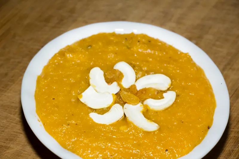 Pumpkin dessert garnished with cashews and raisins.