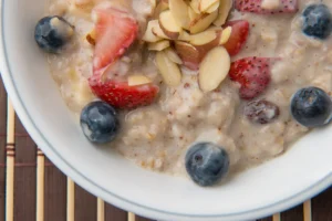 Oatmeal with strawberries, blueberries, and almonds.